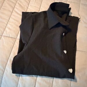 Black button up top with silver heart buttons.